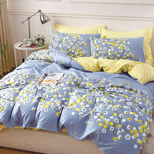 Единично спално бельо с ластик – синьо и жълто с клончета и цветчета